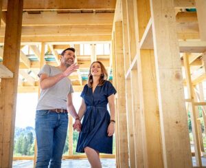 Couple looking at new construction of their house.